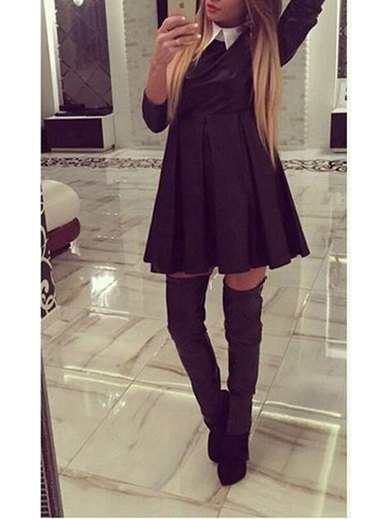 black pleated swing dress with gray thigh high boots