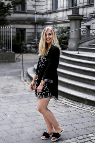 Black printed long sleeve mini dress with gold slippers