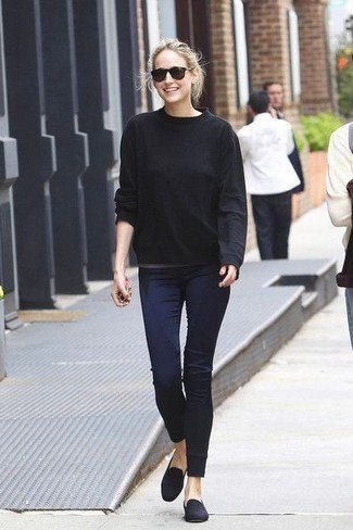 Black loose fitting knit sweater with dark blue skinny jeans and suede loafers