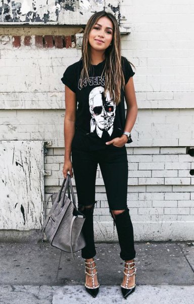 Black graphic tee with rolled sleeves, ripped jeans and sequin
heels