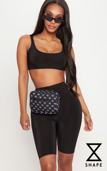 Black cropped scoop neck tank top paired with cycling shorts