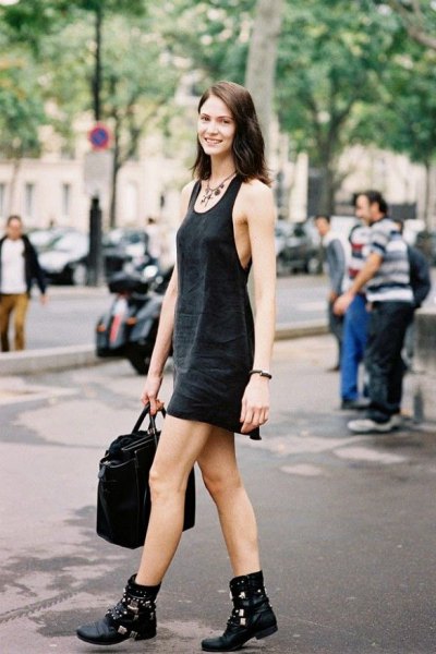 Black mini tank shift dress with a scoop neckline and leather biker boots
