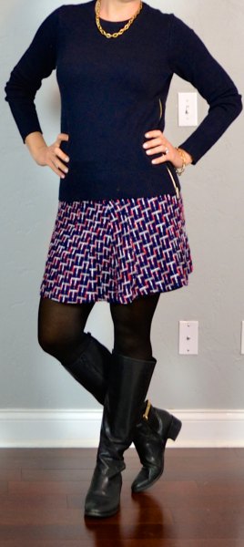 Black scoop neck sweater, printed mini skirt and zipped knee high boots