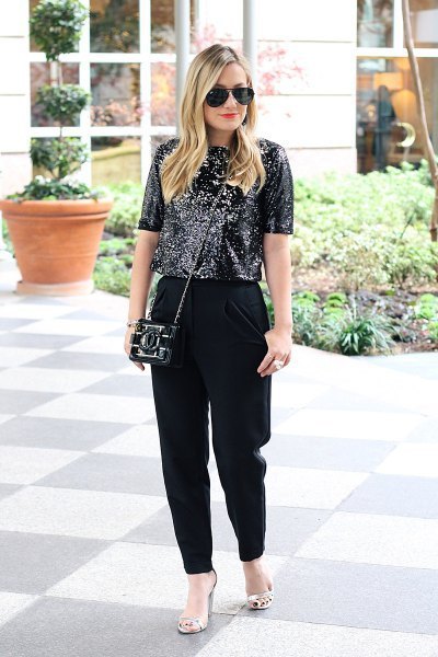 Black sequin top with loose fitting dress pants