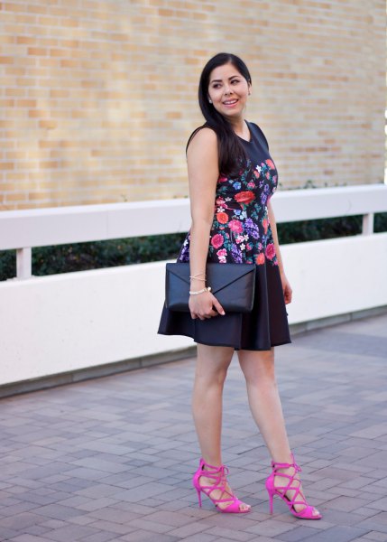 Black sleeveless floral embroidered mini swing dress with pink strappy heels