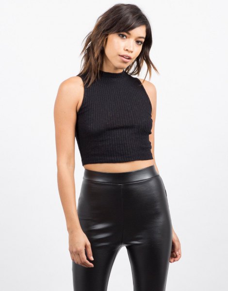Black sleeveless ribbed cropped sweater with leather leggings
