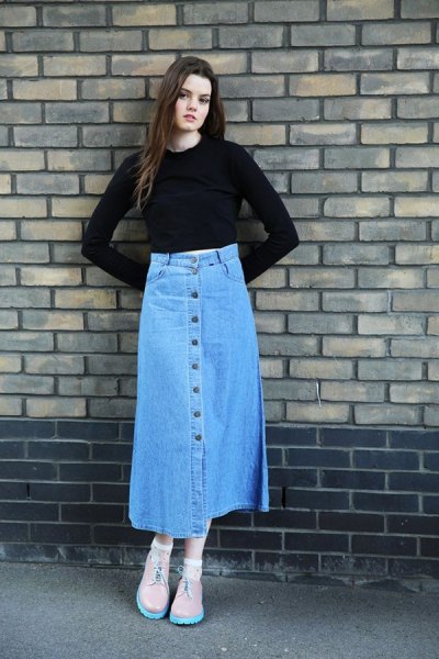 Black slightly cropped top with bell sleeves and blue denim long skirt with buttons down the front