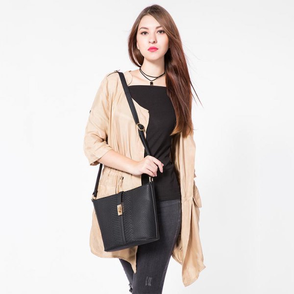 Black top with square neckline, blush cardigan and leather shoulder
bag