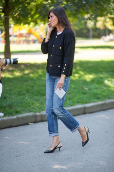 Black sweater with blue jeans with cuffs and kitten heels