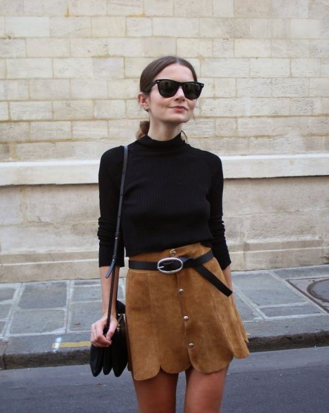 Black sweater with brown scalloped mini skirt and belt