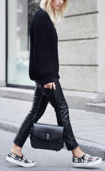 black sweater with leather leggings and gray checked shoes