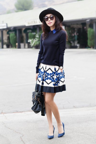 Black sweater with tribal pattern mini pleated skirt