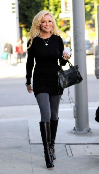 black tunic sweater with gray leggings and knee high leather boots