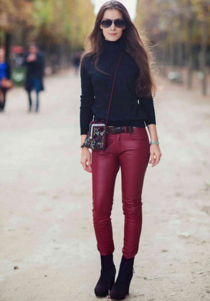 black turtleneck sweater with red skinny leather pants