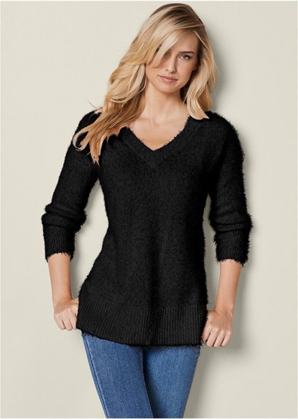 Black slim fit V-neck knitted jumper paired with blue skinny jeans