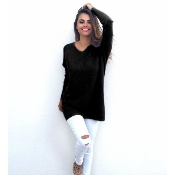 Black V-neck tunic sweater and white ripped skinny jeans