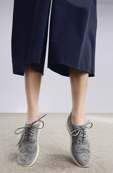 Black wide leg shorts and gray suede wing tip shoes