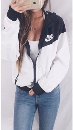Black windbreaker with white plunging scoop neck tank top
