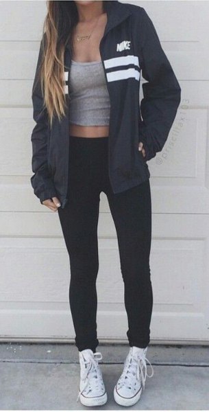 Black windbreaker with gray scoop neck cropped tank top and white canvas sneakers