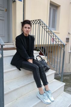 Black wool blazer with leather trousers and silver metallic
sneakers