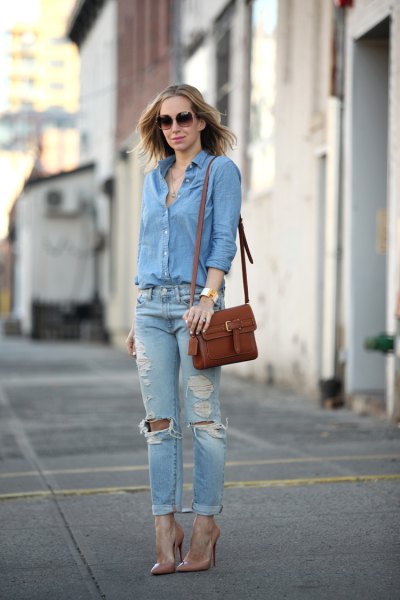 Blue button down shirt and slim fit ripped cuffed jeans