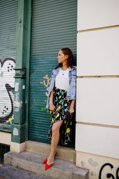 Blue denim jacket with black and yellow printed maxi skirt with side slit