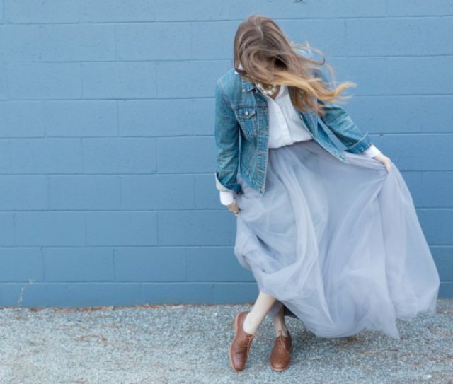 blue denim jacket with white button down shirt and light blue tulle maxi skirt