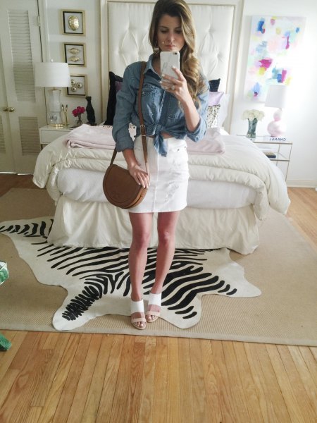 blue knotted chambray shirt with white high rise mini skirt