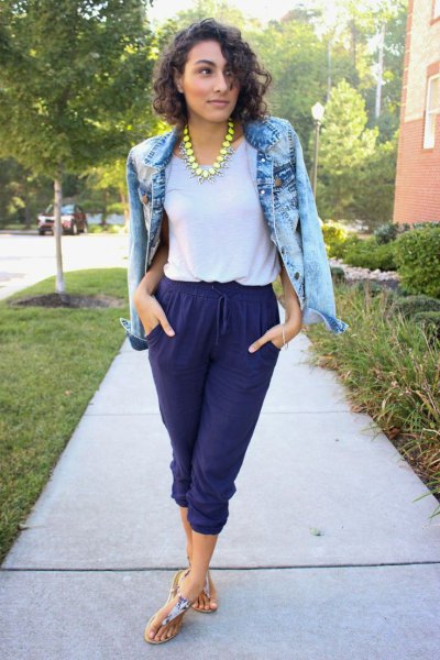 Blue washed denim jacket with blue cropped waist pants and thong
sandals