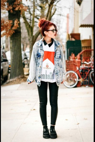 Blue washed denim jacket with a printed polo shirt and leather leggings