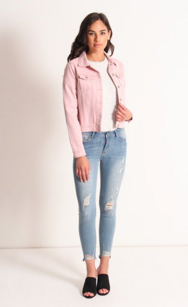 blush denim jacket with white crew neck sweater and light blue jeans