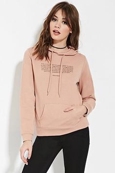 Pink graphic sweater with black skinny jeans and choker