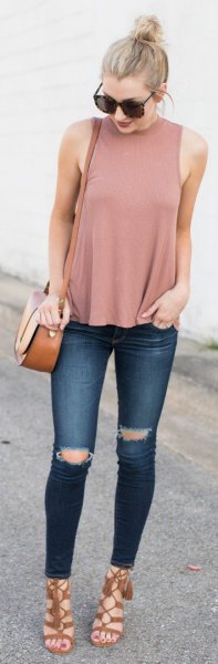 Pale pink turtleneck tank top and dark blue ripped jeans