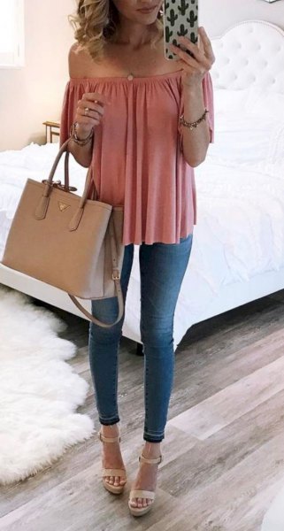 Off-the-shoulder blouse in rouge pink with blue skinny jeans