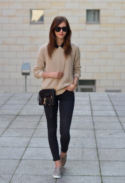 Pink sweater with dark blue skinny jeans and leopard print slip-on shoes