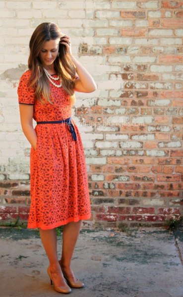 Blush lace midi dress with belted short sleeves and gathered
waist