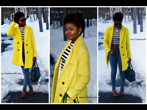 bright yellow double breasted coat with black and white striped
t-shirt