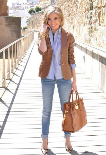 Brown blazer with light blue button down shirt and cuffed jeans