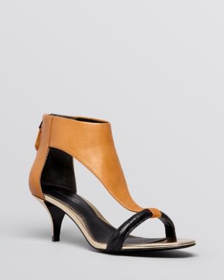 Brown leather kitten heel sandals with black mini fit and flare dress