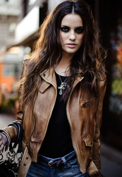 brown leather motorcycle jacket with black t-shirt and blue jeans