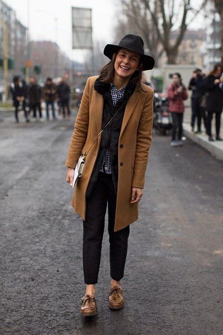 brown longline blazer with black slim-fit pants and slouch hat