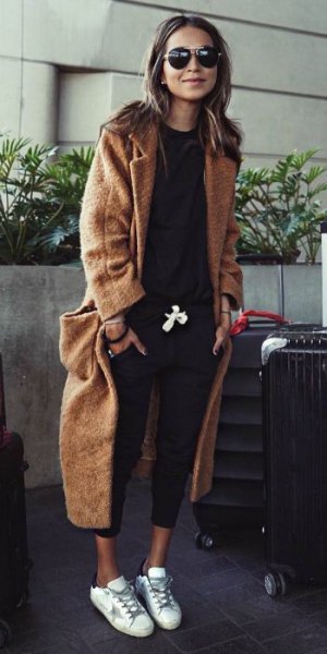 Brown wool maxi travel blazer with black sweatshirt and cropped
jeans