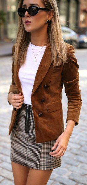 Brown suede blazer with white fitted top and plaid mini skirt