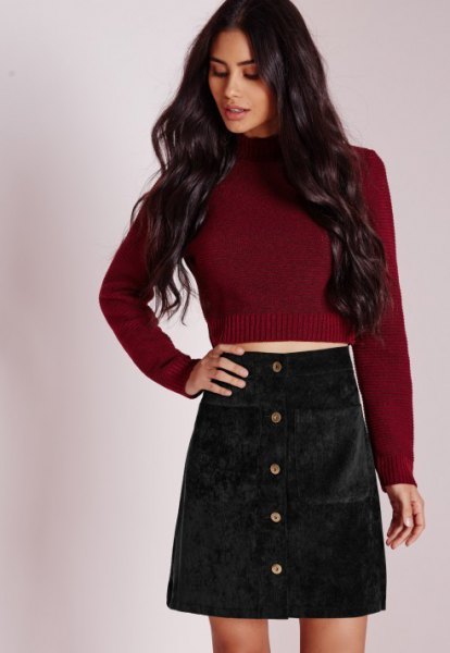 Burgundy knit cropped sweater with black corduroy mini skirt