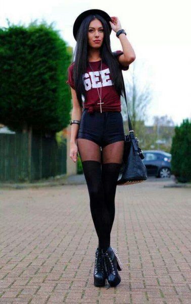 Burgundy knotted t-shirt with black mini shorts and thigh high tights