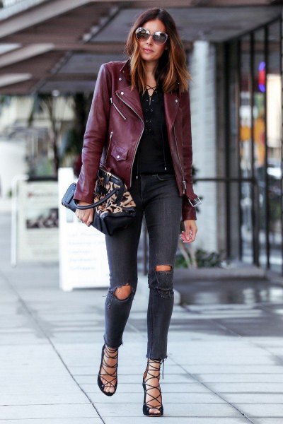 Burgundy oversized leather riding jacket with gray ripped skinny
jeans
