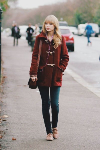Burgundy wool coat with dark gray skinny jeans and tan dress shoes