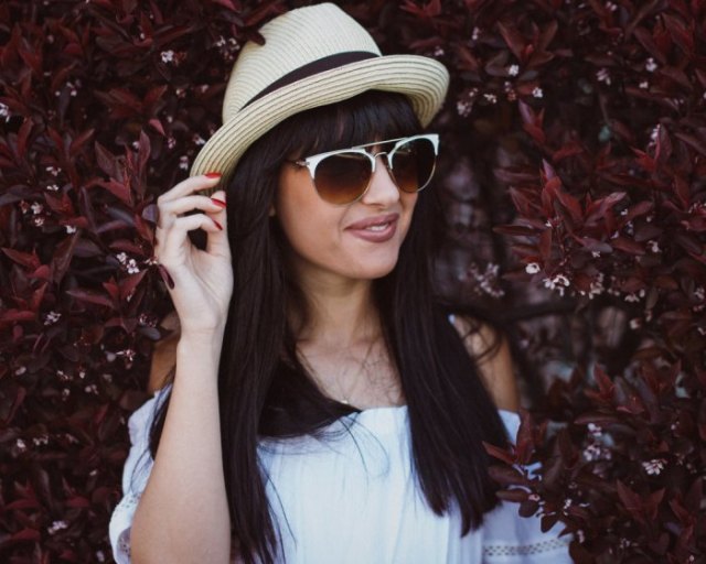 Bush hat with white off-the-shoulder blouse