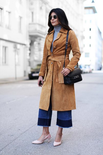 Camel brown belted suede mid-length coat and blue turtleneck sweater