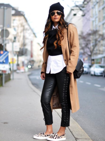 Camel long wool coat with black leather leggings and animal print canvas shoes